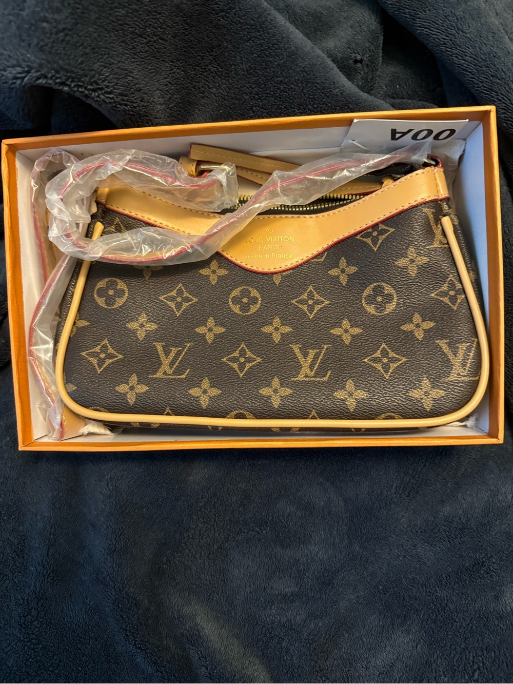 Louis Vuitton Monogram Canvas Mini Pochette in Brown and Tan